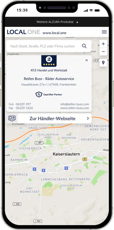Un smartphone muestra la tarjeta de visita digital de un minorista verificado con datos de contacto importantes como la dirección, el número de teléfono y fax y el correo electrónico. También aparece información sobre el sector del minorista y un enlace a su sitio web.